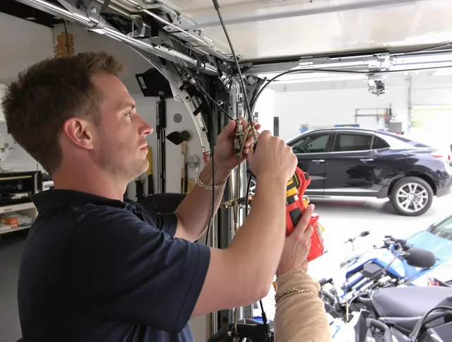Fort Mill Garage Door Repair safety certified technician performing cable replacement in Fort Mill