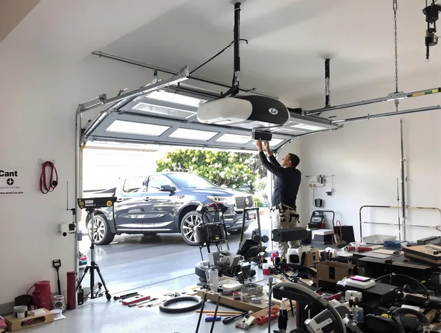 Fort Mill Garage Door Repair specialist installing smart garage door opener system in Fort Mill home