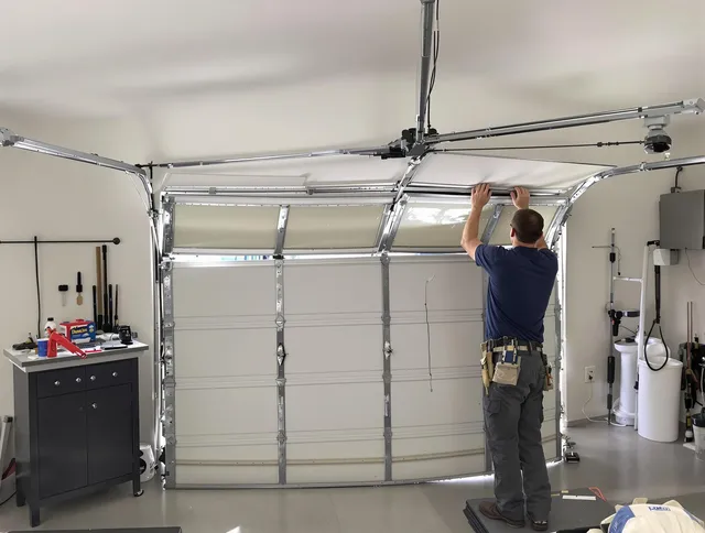 Fort Mill Garage Door Repair specialist performing precise section replacement on Fort Mill garage door